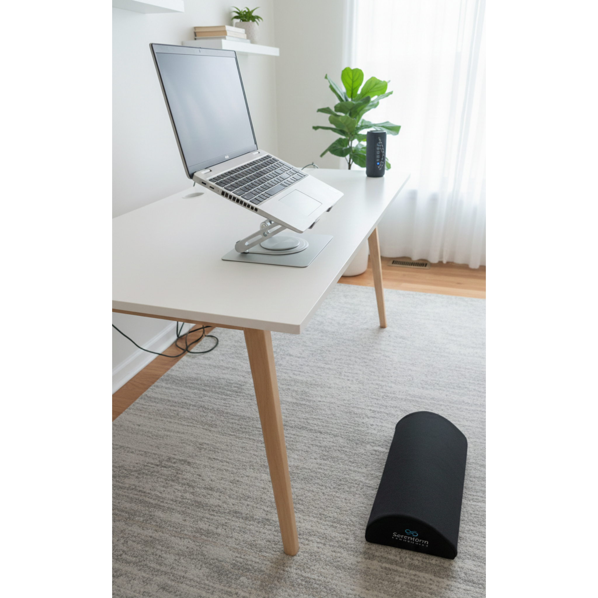 Adjustable laptop stand shown in a clean home office setup, helping raise screen height and support healthier sitting posture
