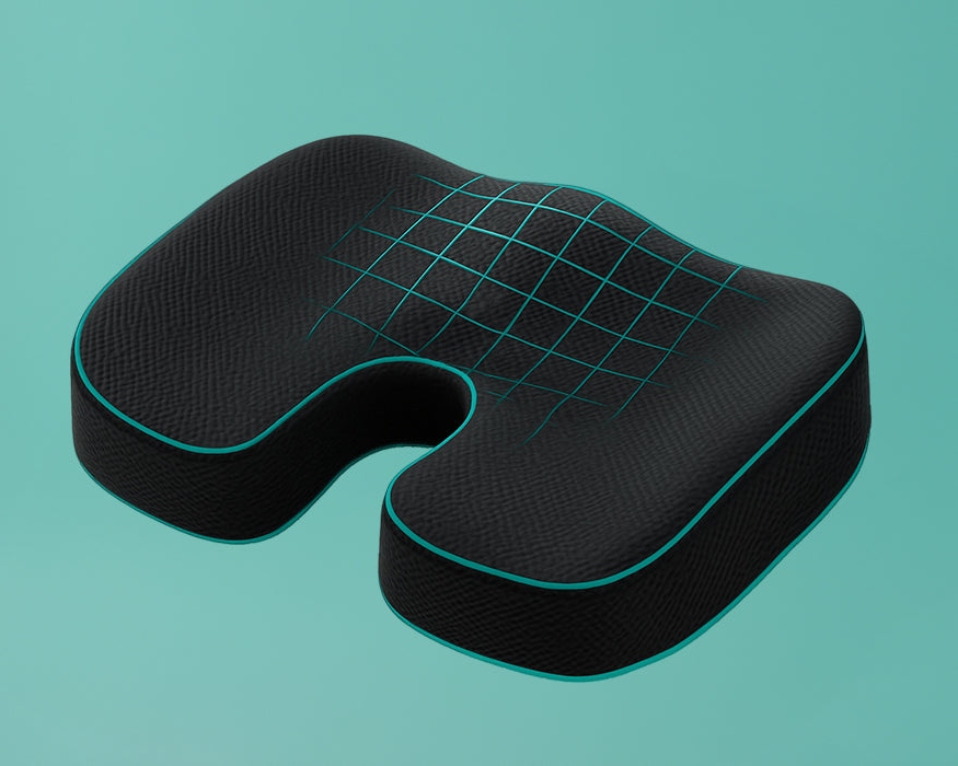 Black ergonomic seat cushion with grid pattern on a teal background